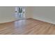 Bright room with wood floors and a glass door to a balcony at 3751 Pompano Se Dr # 3751, St Petersburg, FL 33705