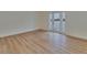 Bright room with wood floors and a glass door to a balcony at 3751 Pompano Se Dr # 3751, St Petersburg, FL 33705