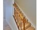 Stairway featuring wooden stairs and handrail with white risers at 3751 Pompano Se Dr # 3751, St Petersburg, FL 33705