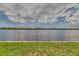 Panoramic view of the lake, showcasing the calm waters and distant shoreline, creating a peaceful atmosphere at 3751 Pompano Se Dr # 3751, St Petersburg, FL 33705