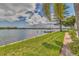 Picturesque waterfront view with boats docked along the shoreline, complemented by lush greenery and a serene ambiance at 3751 Pompano Se Dr # 3751, St Petersburg, FL 33705