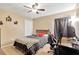 Bedroom with carpeted floors, neutral paint and ceiling fan, illuminated by natural light at 3913 Little Egret Ct, Lutz, FL 33558