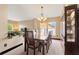 Dining room showcasing a large table, china cabinet, and a view into the living area at 3913 Little Egret Ct, Lutz, FL 33558