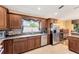 Well-lit kitchen featuring custom cabinets, granite countertops, and stainless steel appliances at 3913 Little Egret Ct, Lutz, FL 33558