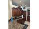 Well-equipped kitchen boasts stainless steel appliances, granite countertops, and dark wood cabinetry at 3913 Little Egret Ct, Lutz, FL 33558
