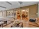 Back patio with sliding glass doors, views of the pool and access to the interior dining and living areas at 3913 Little Egret Ct, Lutz, FL 33558