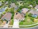 Beautiful aerial view of home with pool, landscaped yard, and solar panels in established East Lake Woodlands community at 4769 Stoneview Cir, Oldsmar, FL 34677