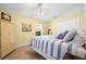 Bedroom with closet, yellow walls and bright window at 4769 Stoneview Cir, Oldsmar, FL 34677