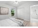 Clean bedroom with natural light, closet, and ensuite bathroom access at 4769 Stoneview Cir, Oldsmar, FL 34677