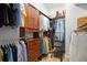 Well-organized walk-in closet featuring ample storage and wooden cabinetry at 4769 Stoneview Cir, Oldsmar, FL 34677