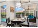 Bright dining area with pool view, connected to an outdoor living space at 4769 Stoneview Cir, Oldsmar, FL 34677
