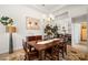 Bright dining room with chandelier, mirror and artwork, perfect for entertaining at 4769 Stoneview Cir, Oldsmar, FL 34677