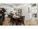 Elegant dining room featuring a large mirror and a classic chandelier at 4769 Stoneview Cir, Oldsmar, FL 34677