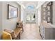 Welcoming home entrance featuring tiled floors and a glass double-door entryway at 4769 Stoneview Cir, Oldsmar, FL 34677