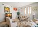 Cozy living room featuring hardwood floors, comfortable seating, and bright windows at 4769 Stoneview Cir, Oldsmar, FL 34677