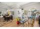 Open living area with hardwood floors, comfortable seating, and dining space at 4769 Stoneview Cir, Oldsmar, FL 34677