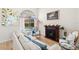 Living room with a fireplace, a window and a comfortable seating area at 4769 Stoneview Cir, Oldsmar, FL 34677