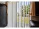 View of the backyard through sliding glass doors, offering outdoor access and natural light at 4816 E 99Th Ave, Tampa, FL 33617