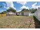 Backyard featuring a privacy fence and lawn at 4816 E 99Th Ave, Tampa, FL 33617