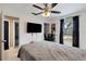 Bedroom includes a TV, closet and window at 4816 E 99Th Ave, Tampa, FL 33617