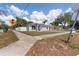 Well-maintained single-story home with a clean, bright exterior and a fenced yard at 4816 E 99Th Ave, Tampa, FL 33617