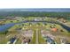 An aerial view of a lake community, showcasing spacious lots and waterfront properties at 5325 San Remo Cir, Wimauma, FL 33598