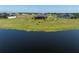 Waterfront home with a large lawn, and beautiful lake view at 5325 San Remo Cir, Wimauma, FL 33598