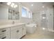 Modern bathroom with double vanity, soaking tub, large mirror, and a separate glass shower at 5325 San Remo Cir, Wimauma, FL 33598