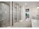 Luxurious bathroom featuring a spacious shower with elegant tile work and modern fixtures at 5325 San Remo Cir, Wimauma, FL 33598