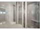 Bright bathroom showcasing a large shower with glass enclosure and neutral tile at 5325 San Remo Cir, Wimauma, FL 33598