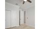 This is a bedroom showcasing light walls, wood-look floors, closet, and an open doorway at 5325 San Remo Cir, Wimauma, FL 33598