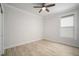 Cozy bedroom with a ceiling fan and a window providing natural light at 5325 San Remo Cir, Wimauma, FL 33598