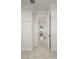 Walk-in closet with shelving that leads to an open bathroom with a shower at 5325 San Remo Cir, Wimauma, FL 33598