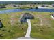 Stunning home overlooking the lake with a long drive way at 5325 San Remo Cir, Wimauma, FL 33598