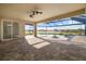 The screened-in patio offers scenic pool and lake views, perfect for relaxation and entertainment at 5325 San Remo Cir, Wimauma, FL 33598