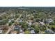 An aerial view of a residential area with mature trees, highlighting the surrounding neighborhood and the city skyline at 6213 10Th S Ave, Gulfport, FL 33707