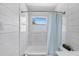 Well-lit bathroom with a tub, white tile, and updated fixtures, creating a fresh space at 6213 10Th S Ave, Gulfport, FL 33707