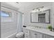 Clean bathroom featuring a shower-tub combination, white tile, and modern fixtures at 6213 10Th S Ave, Gulfport, FL 33707