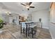 Bright dining area featuring an open floorplan, stylish furnishings, and modern lighting at 6213 10Th S Ave, Gulfport, FL 33707
