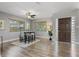 Bright dining room features a ceiling fan, a modern table set and light gray colored walls at 6213 10Th S Ave, Gulfport, FL 33707