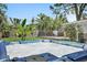 Close up view of a hot tub with bubbling water and lush greenery in the background at 6213 10Th S Ave, Gulfport, FL 33707