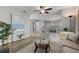 Open-concept living room with modern furnishings, stylish decor, and lots of natural light at 6213 10Th S Ave, Gulfport, FL 33707