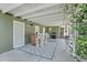 Covered patio area with a built-in bar, grill, and outdoor dining space at 6213 10Th S Ave, Gulfport, FL 33707