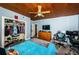 Updated bedroom features gray wood floors, a ceiling fan, a closet, and a wood plank ceiling at 6238 92Nd N Pl # 3201, Pinellas Park, FL 33782