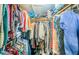 Walk-in closet with extensive shelving and hanging space offers ample storage for clothes and accessories at 6238 92Nd N Pl # 3201, Pinellas Park, FL 33782