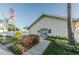 Exterior of the community clubhouse with flags and landscaping at 6238 92Nd N Pl # 3201, Pinellas Park, FL 33782