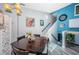 Dining area with stairs leading up, enhanced with artwork, and a decorative screen nearby at 6238 92Nd N Pl # 3201, Pinellas Park, FL 33782