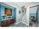 Stylish entryway featuring wood-look floors, decorative accents, and a staircase leading to the upper level at 6238 92Nd N Pl # 3201, Pinellas Park, FL 33782