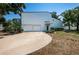 Charming two-story home featuring a double garage, mature trees and a welcoming driveway at 6238 92Nd N Pl # 3201, Pinellas Park, FL 33782