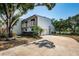 Charming two-story home featuring a double garage, dual balconies, mature trees and a welcoming driveway at 6238 92Nd N Pl # 3201, Pinellas Park, FL 33782